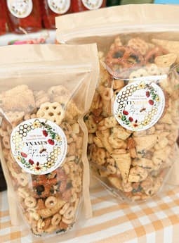 Bags of seasonal honey snack mix with Tynanes labels